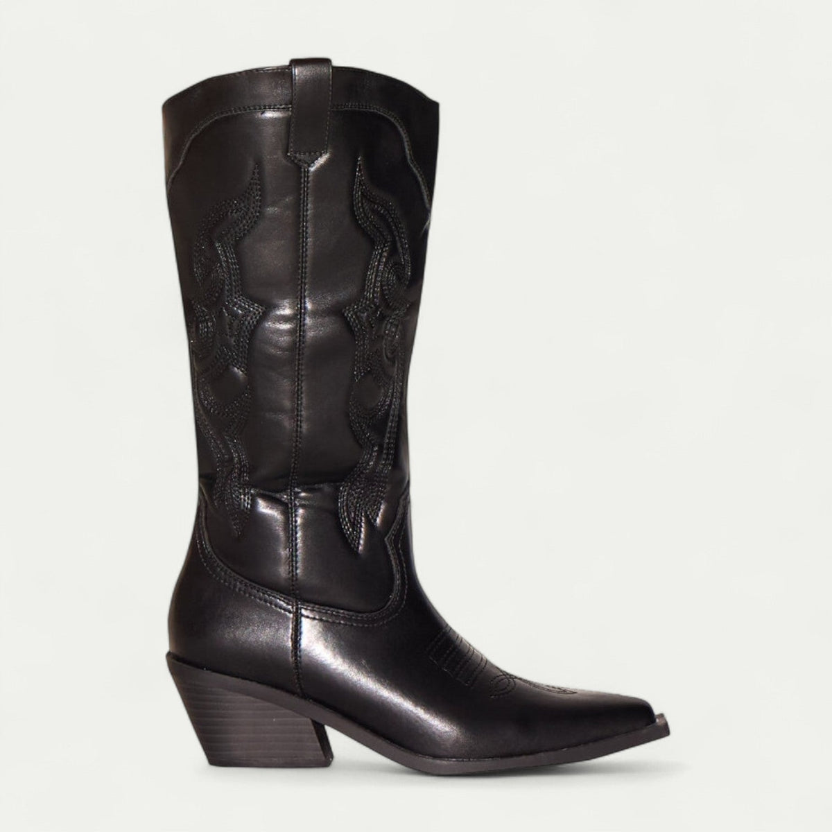 Women's black boots with pointed toe, ornate stitch panel, stacked block heel