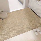 Beige jute-look entry doormat with textured surface and non-slip backing.