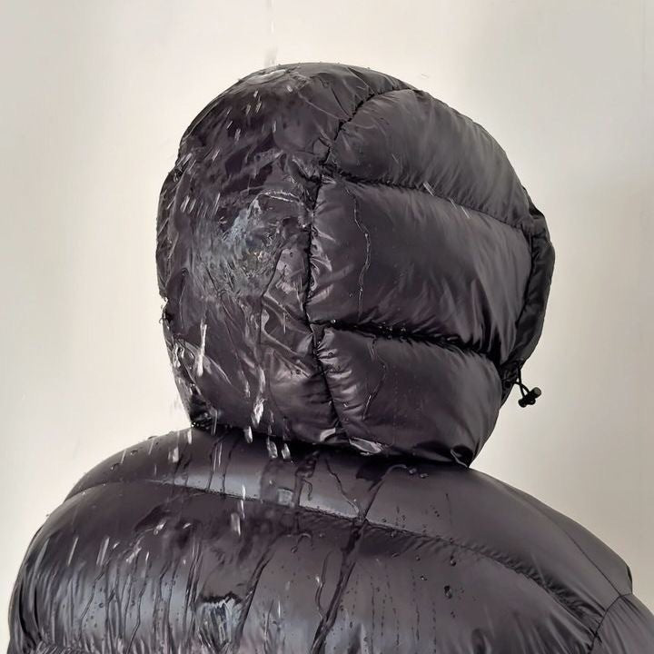 Black quilted hood with drawstring, puffer jacket close-up