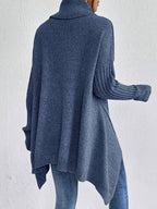 Dark blue women’s loose turtleneck sweater with long sleeves and high-low hem