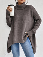 Brown women’s loose turtleneck sweater with long sleeves and high-low hem