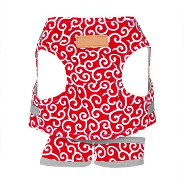 Red patterned cat vest harness with gray straps and tan label patch