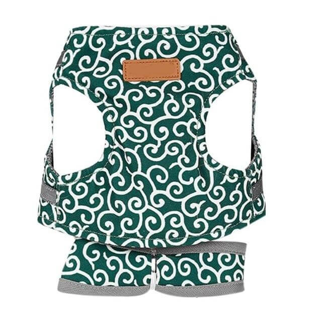 Green patterned cat vest harness with gray straps and tan label patch