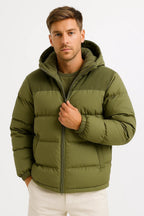 Olive green hooded winter puffer jacket, full-zip front and ribbed cuffs