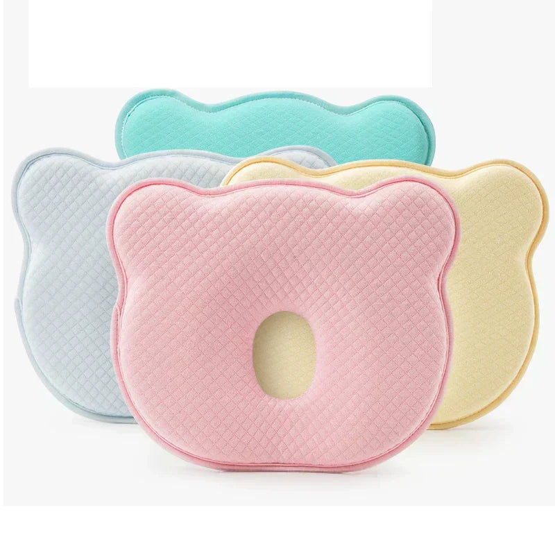 Contoured baby head support pillow set in assorted colors: blue, pink, yellow, green