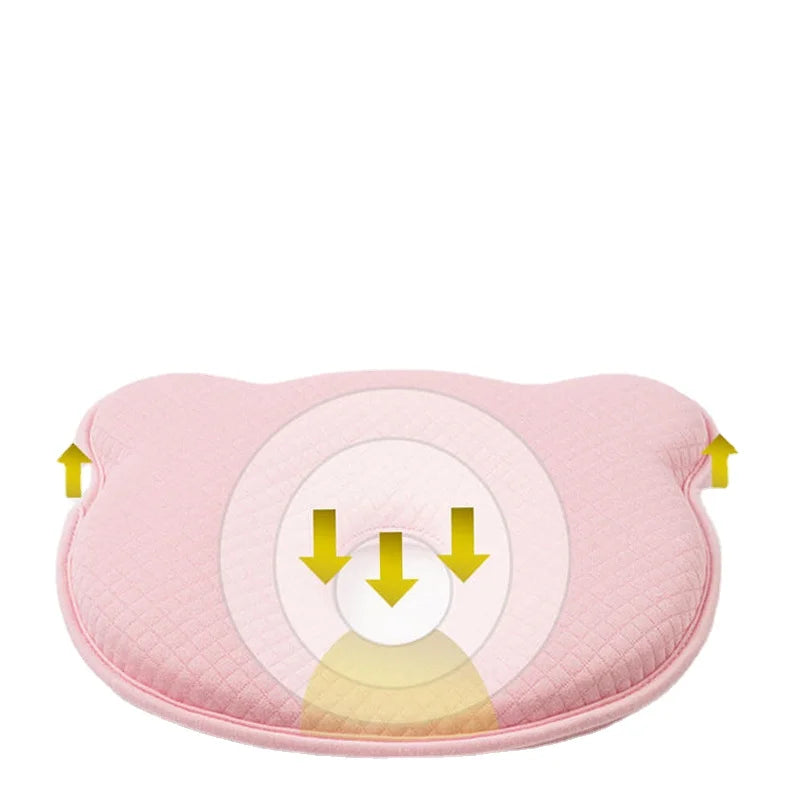 Pink contoured baby head support pillow with cushioned head channel and face cutout