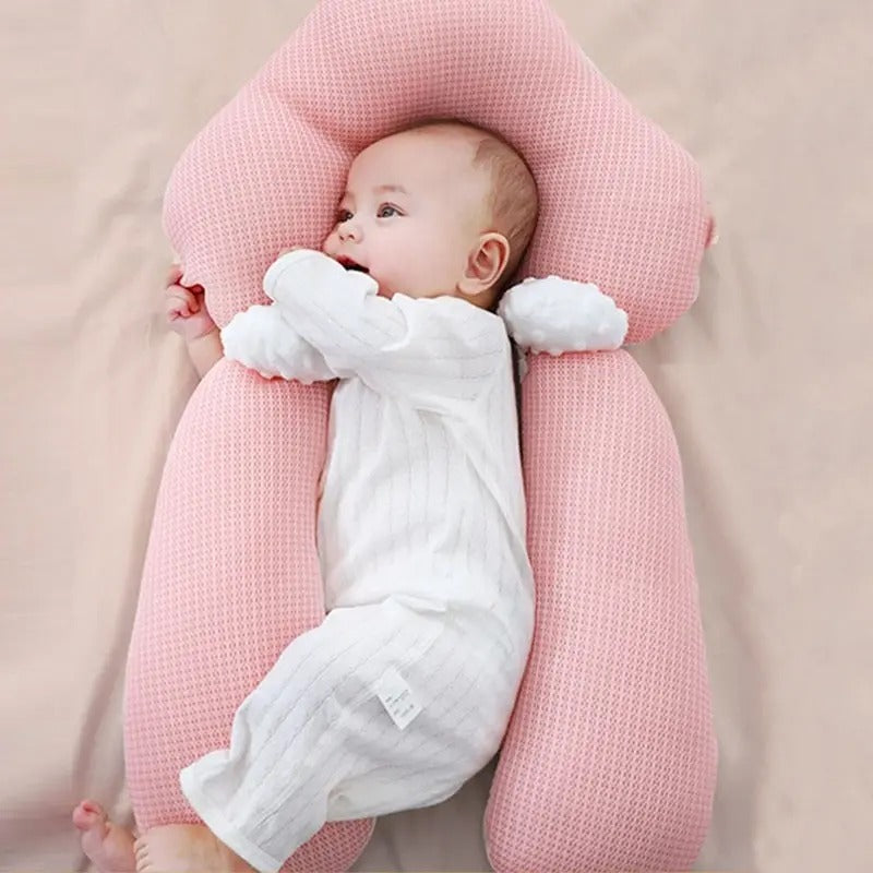 Pink ergonomic baby cushion with head support and plush side arms