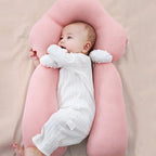 Pink ergonomic baby cushion with head support and plush side arms
