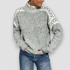 Light gray knit sweater with jacquard patterned shoulders, ribbed high neck, long sleeves