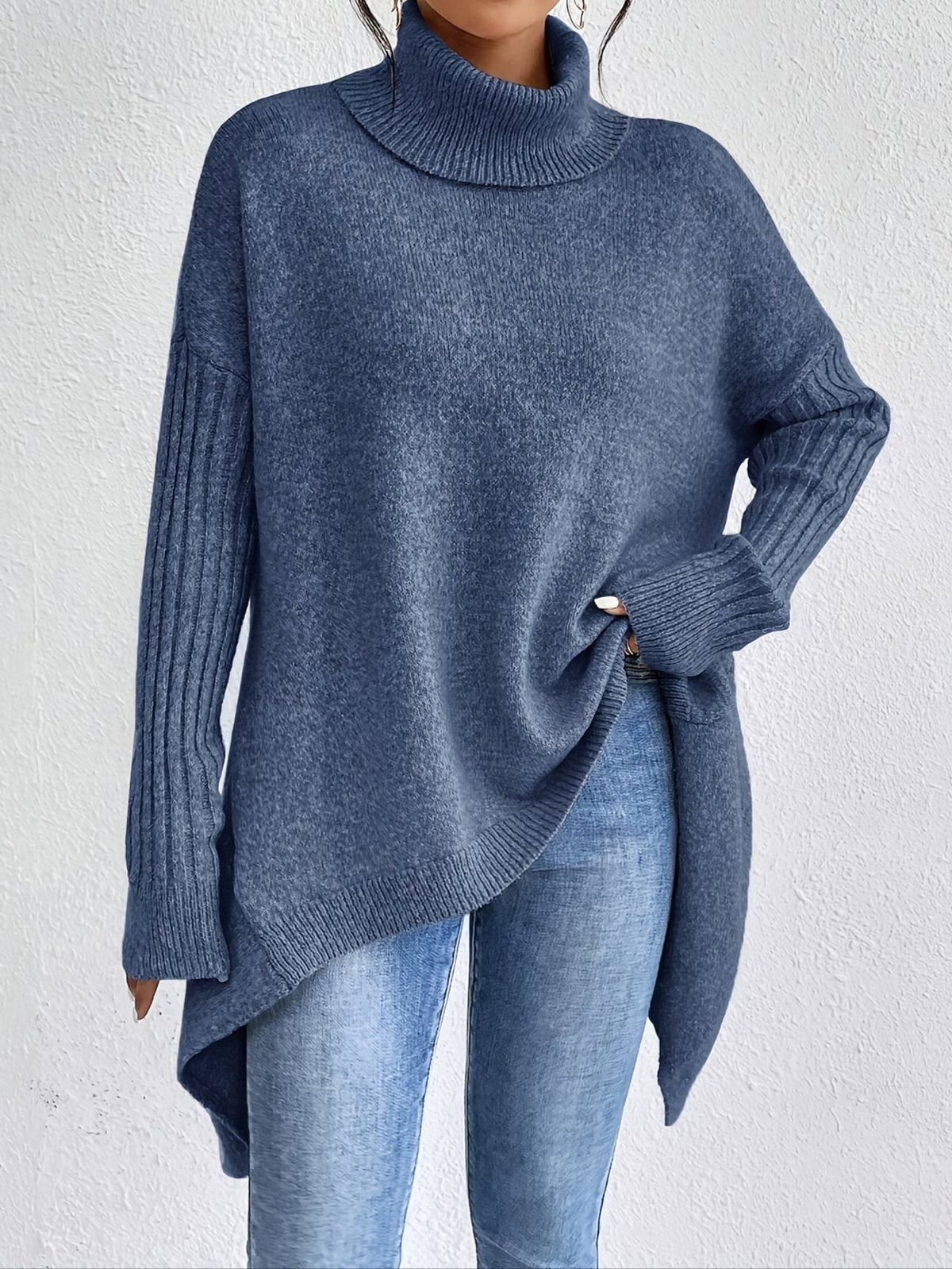 Women's loose turtleneck sweater in blue, long sleeves, ribbed cuffs, asym hem