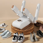 White electric boot dryer on a round stand with four shoe-drying arms