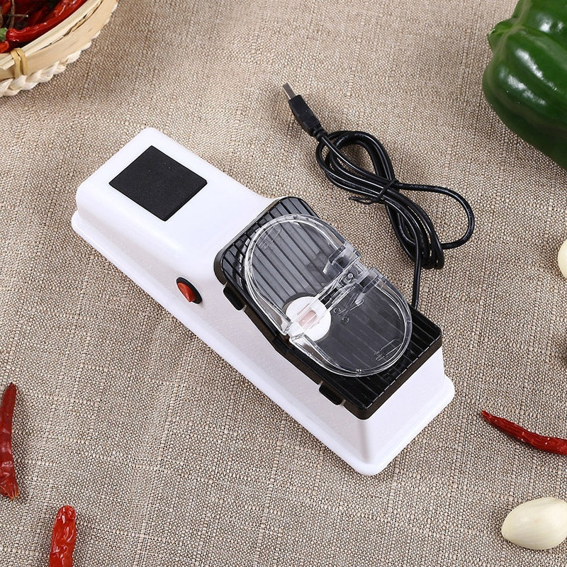 Compact electric knife sharpener with clear sharpening window and black charging cable