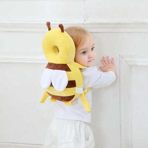 Bee-shaped padded head protector backpack with adjustable straps worn by a baby