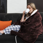 Burgundy plush electric flannel blanket wrapped with visible white power cord