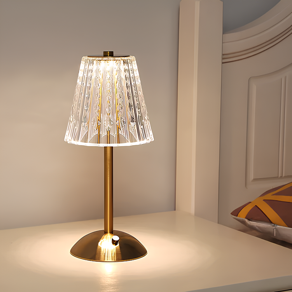 Golden crystal table lamp with faceted shade and brushed aluminum base