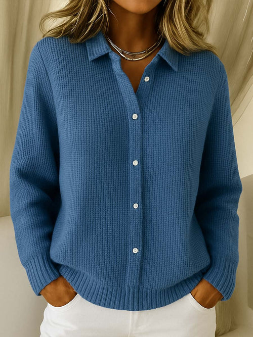 Women's navy blue button-front knit sweater with pointed collar and long sleeves