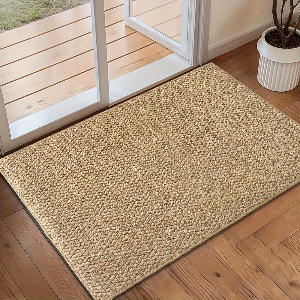 Beige jute-look doormat with textured weave, placed on hardwood floor.