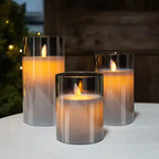 Flameless candle set with three amber glass holders and warm LED flames