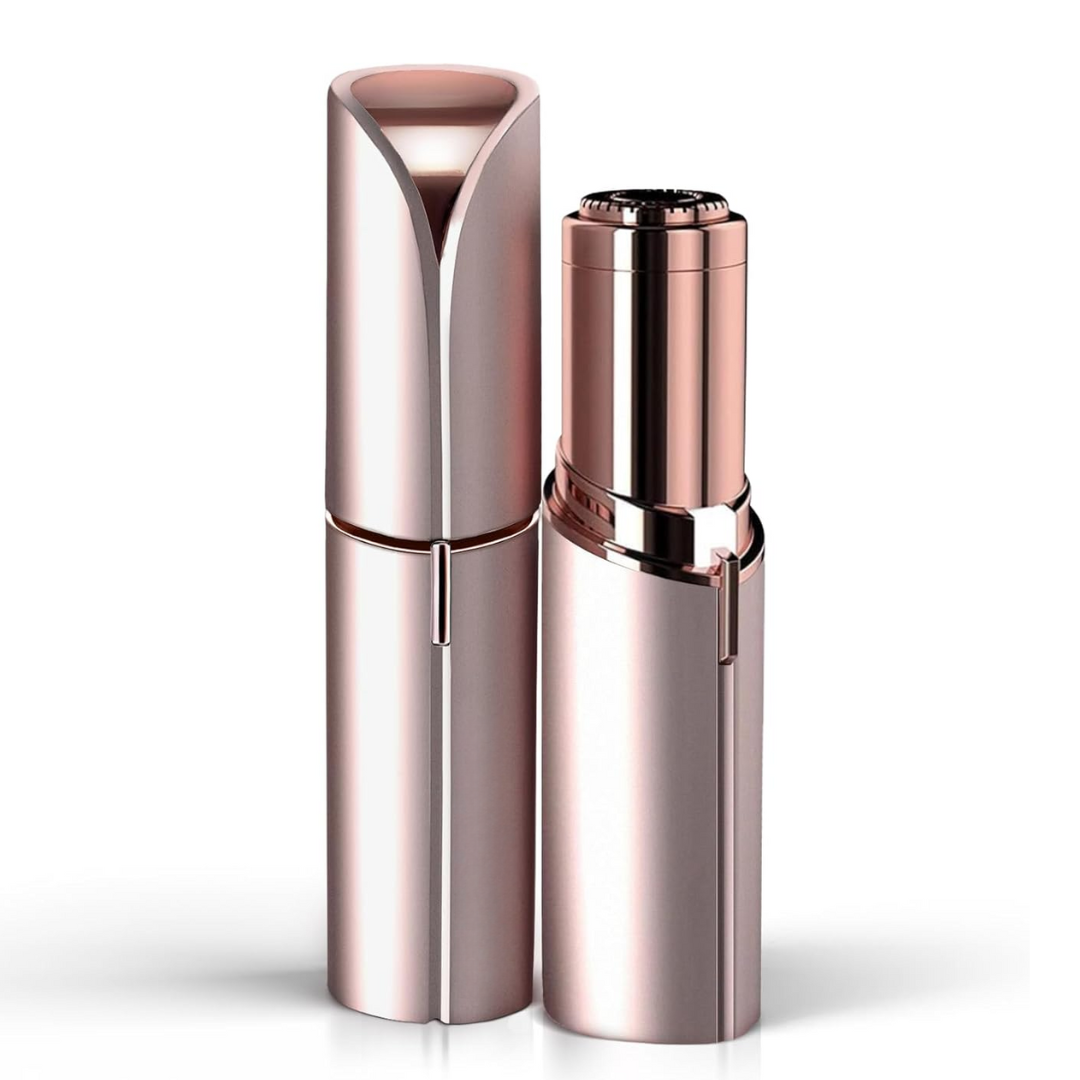 Electric facial hair trimmer in rose-gold finish with protective cap and trimming head.