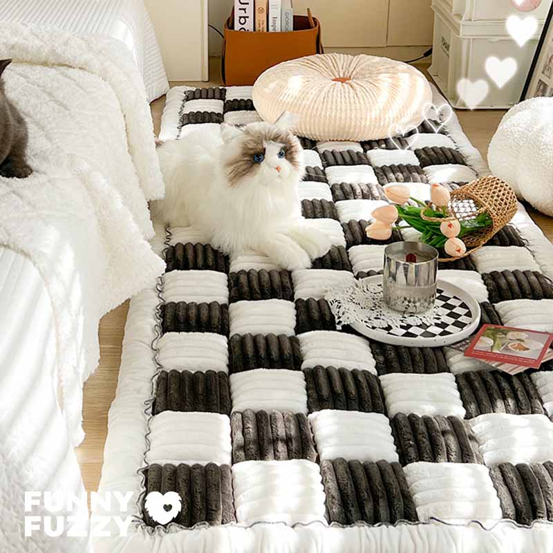 Chenille pet blanket with black and white striped tiles and scalloped edge