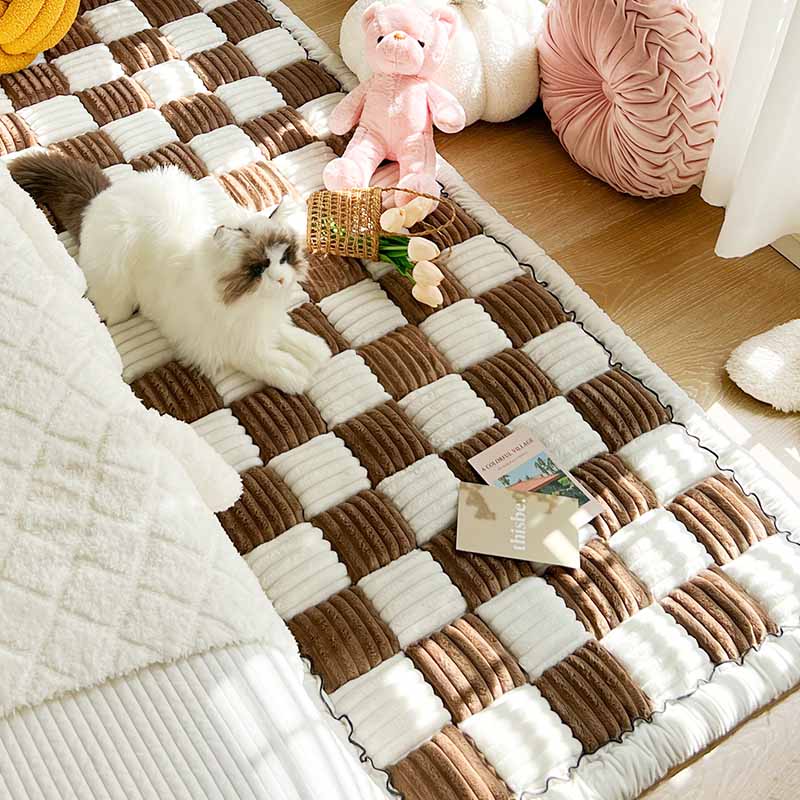 Chenille pet blanket with brown and white striped tiles and scalloped edges