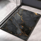 Diatomaceous earth bath mat with black base and gold marbled pattern