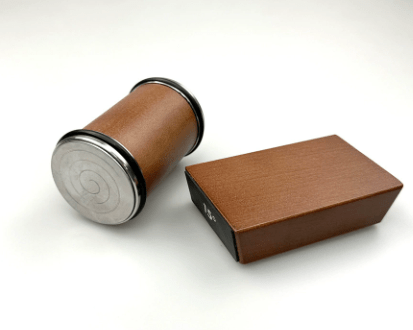 Brown rolling knife sharpener base with metal roller end for sharpening