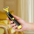 Handheld electric shaver in a hand, black and yellow with foil cutting head