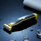 Electric shaver with foil head on water droplets, black and yellow rechargeable razor
