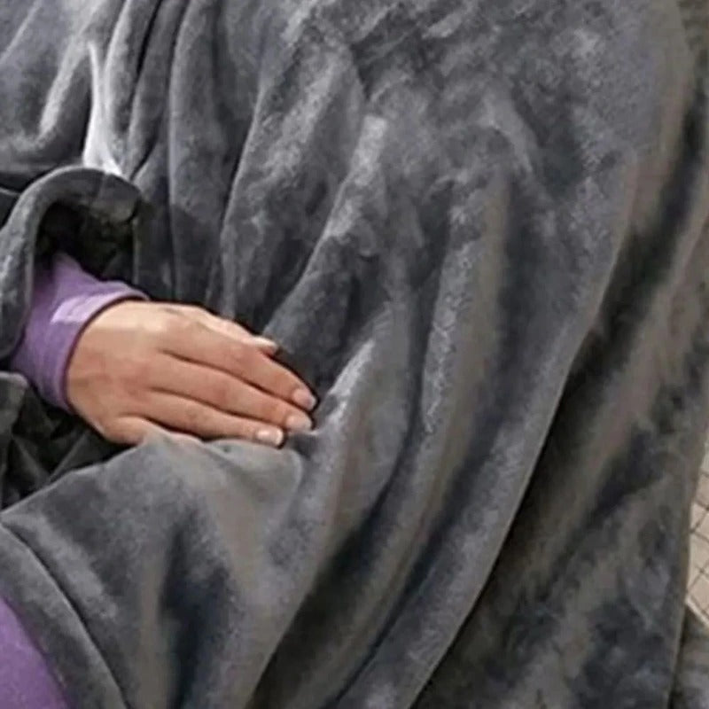 Dark gray heated throw close-up with front pocket and soft fabric texture