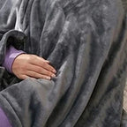 Dark gray heated throw close-up with front pocket and soft fabric texture