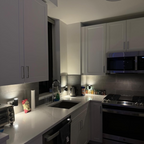 White minimalist LED night light with cylindrical shade, warm glow