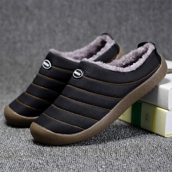 Men's lined slip-on slippers in black with faux-fur lining, striped seams, and rubber sole