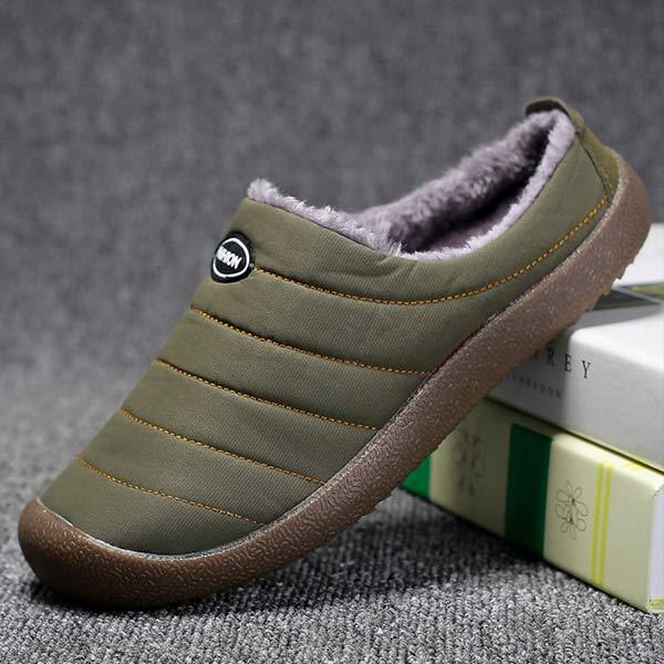 Men's lined slip-on slippers in green, side view with faux-fur lining and striped stitching