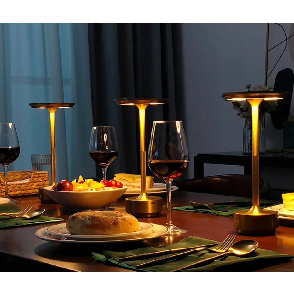 Cordless LED table lamps on a dining table with warm glowing round top shades