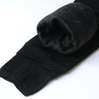 Fleece-lined winter leggings, dark charcoal with rolled black fleece lining at ankle