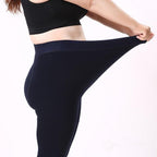 Fleece-lined winter leggings, dark navy worn with waistband and full-length leg coverage
