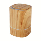 Orange woodgrain aromatherapy diffuser with top opening and base button