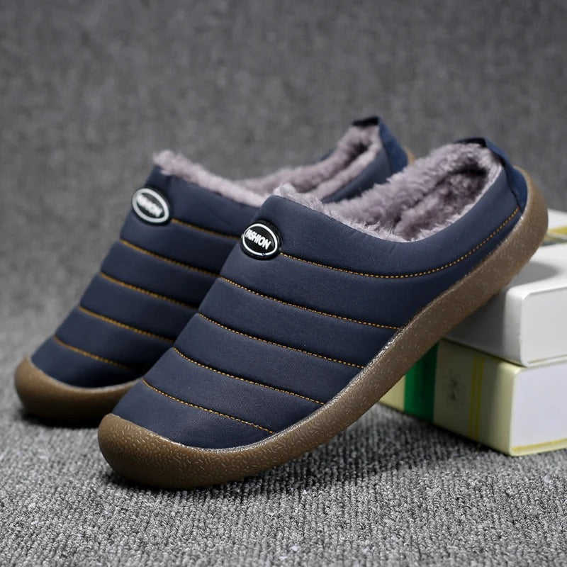 Men's lined slip-on slippers in blue with faux-fur lining, padded collar, and rubber sole
