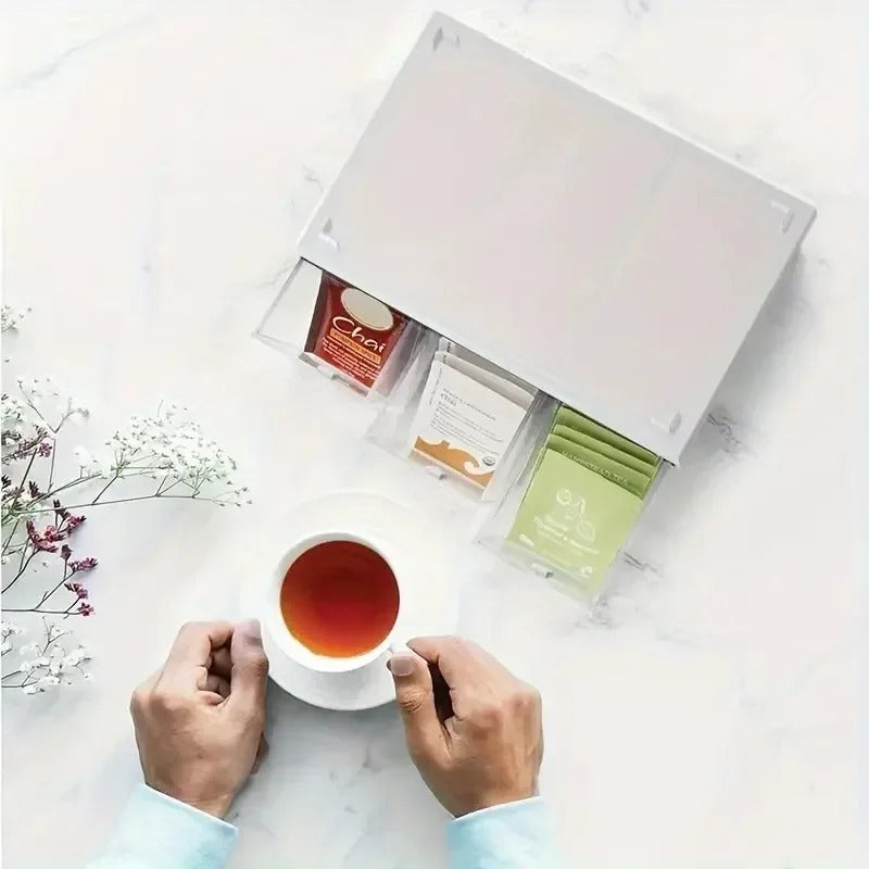 Tea box organizer with 3 drawers, white lid; open compartments holding tea bags