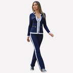 Blue tracksuit set with zip-front jacket and flared pants, white contrast piping.