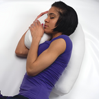 White ergonomic side sleeper pillow with ear cut-out supporting head and neck