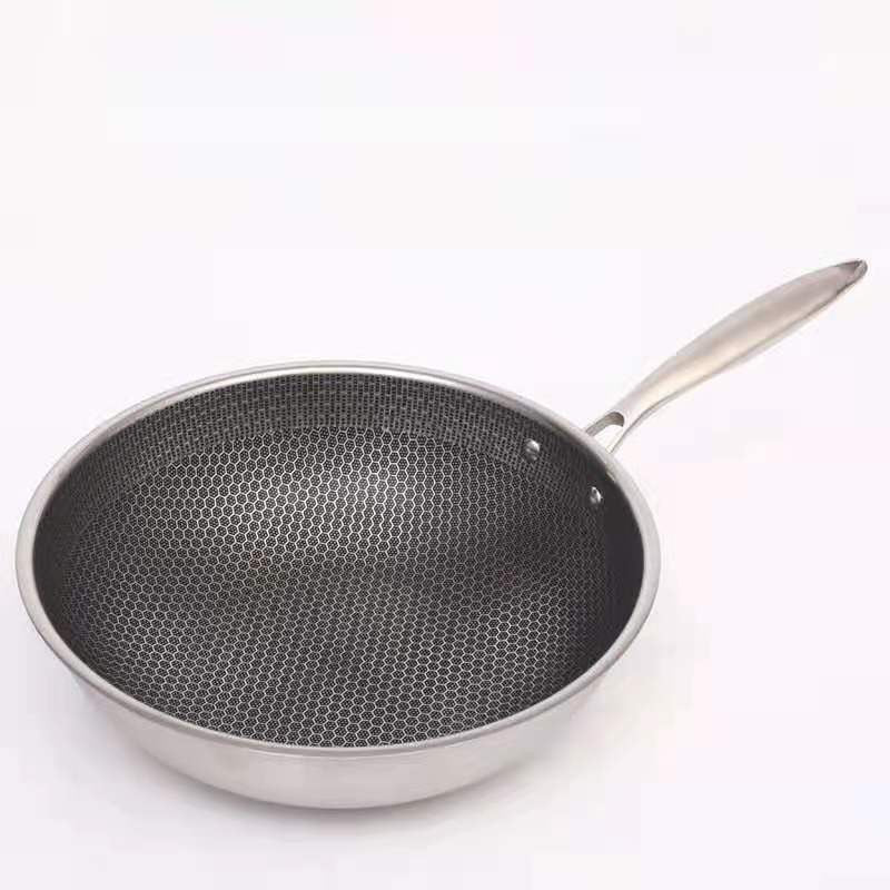 Stainless steel frying pan with dark honeycomb non-stick interior and curved spout