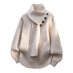 Women’s light beige knit sweater with attached scarf-style tie neckline and button closure