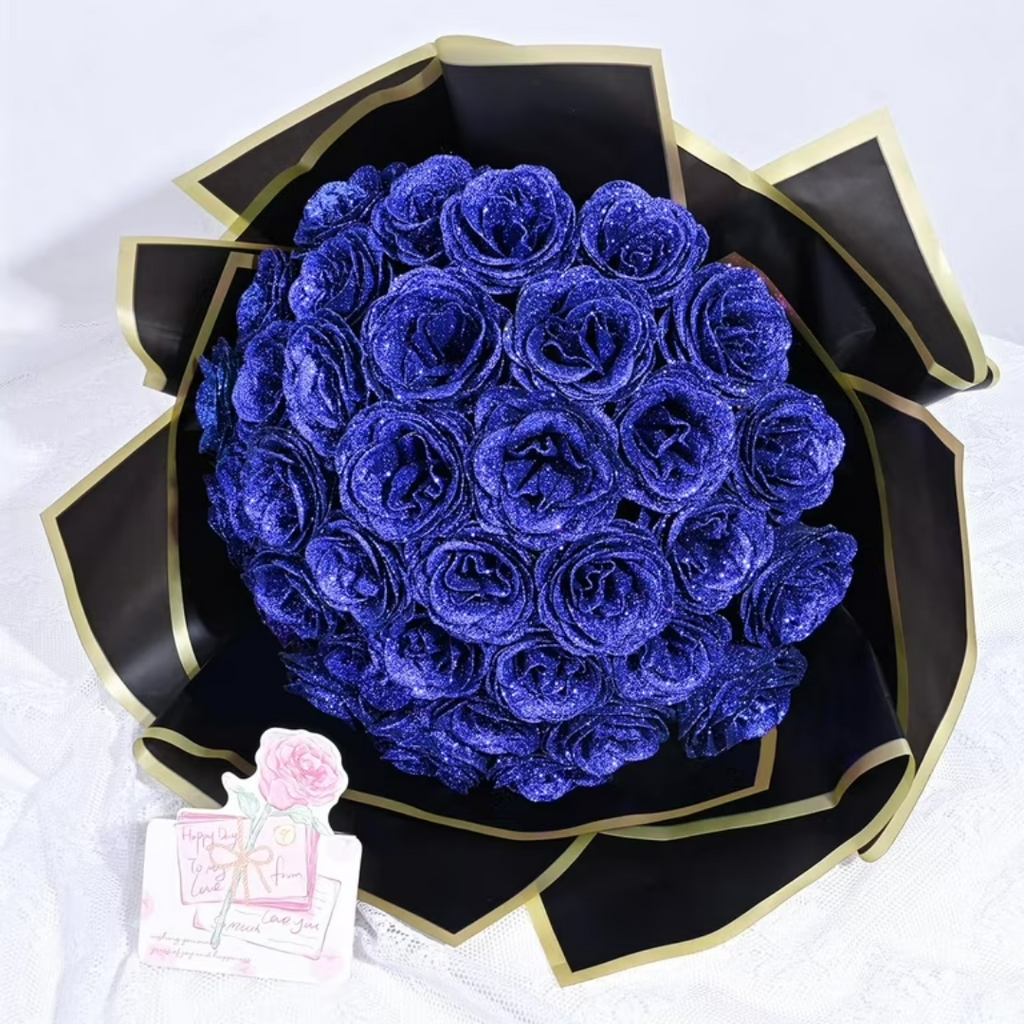 Preserved roses gift box with glittery blue roses in black and gold wrap, card