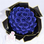 Preserved roses gift box with glittery blue roses in black and gold wrap, card