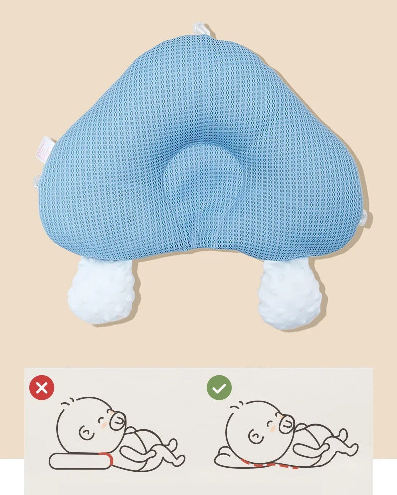 Blue ergonomic baby cushion with plush foot pads and rounded head support