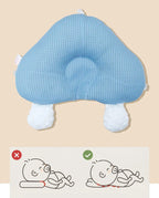 Blue ergonomic baby cushion with plush foot pads and rounded head support