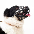 Black breathable mesh dog muzzle with triangular cutouts and adjustable straps
