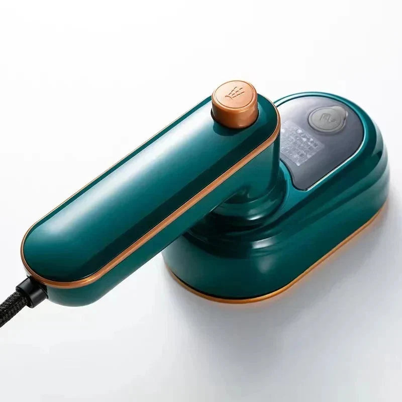 Green mini steam iron with dry and steam controls, copper temperature dial, compact handle